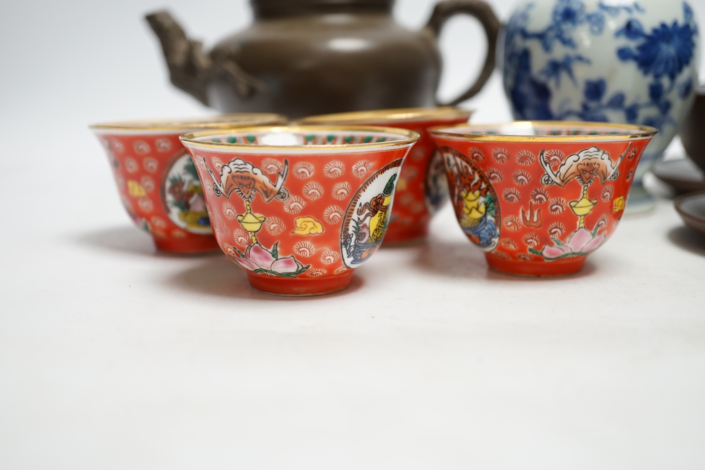 A Chinese blue and white tea caddy, four tea bowls, four cups and saucers and a teapot, largest 17cm high